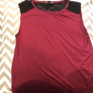 An maroon top with black lace on the shoulders!